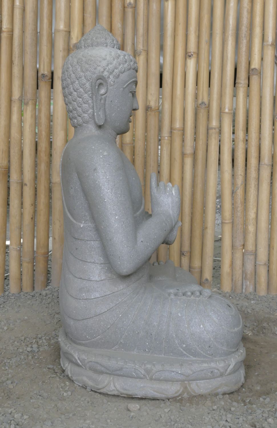  Product image 5 of the product “Seated Buddha made of Riverstone in Dharmachakra gesture of wheel of the teaching of the Dharma, H. 83cm. There is a stone eye on the left shoulder. ”